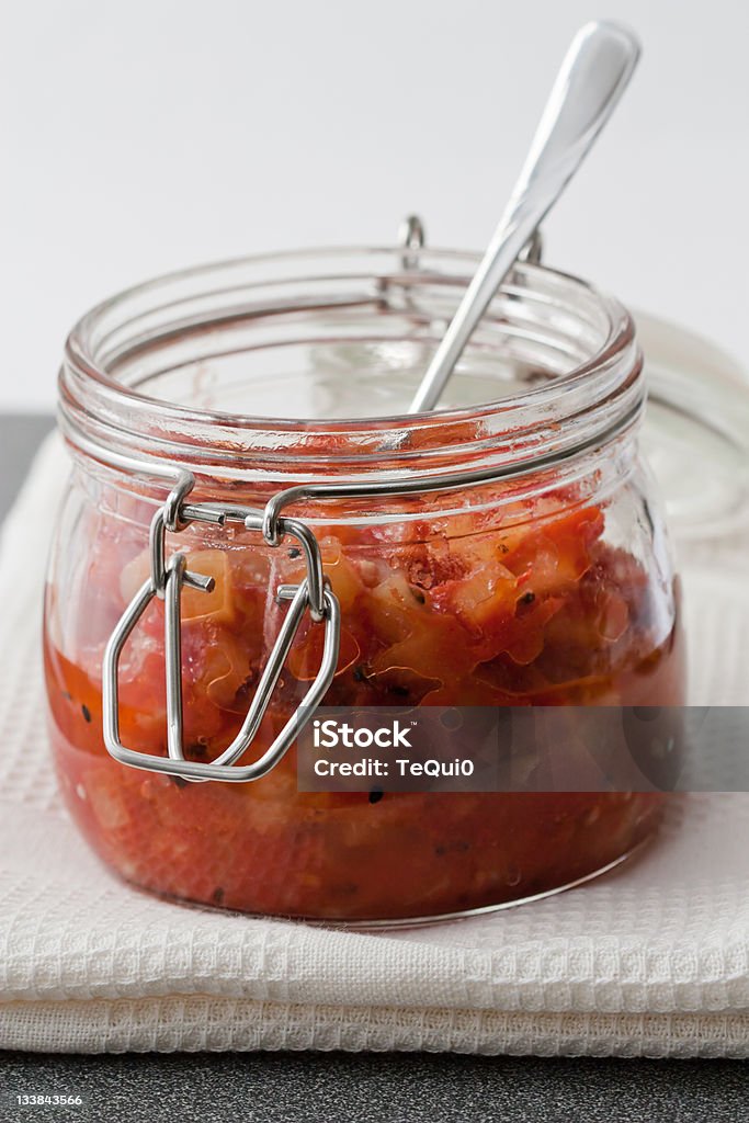 Pineapple Chutney Preserving glass with pineapple chutney which is a traditional Indian sauce. Chutney Stock Photo