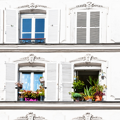 Windows of an old Parisian residential building, in Montmartre.