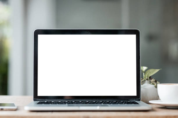 istock Mockup of laptop computer with empty screen with coffee cup and smartphone on table of the coffee shop background,White screen 1338438139