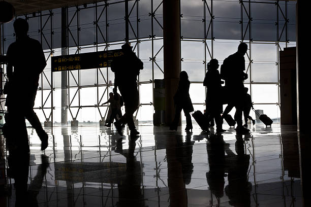 istock Silhouette of airport travellers 133843961