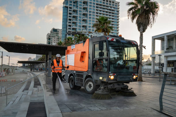 A Street Cleaner Tel Aviv, Israel - August 17th, 2021: A street sweeper at work, early morning, on the Lahat promenade, near the Tel Aviv, Israel, beach. street sweeper stock pictures, royalty-free photos & images