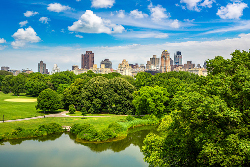 Panoramic view of Manhattan cityscape over Turtle pond in Central Park in New York City, NY, USA