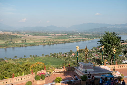the view of the Mekong river and over to Lao from the Temple Wat Phra That Pha Ngao in the town of Chiang Saen  in the golden triangle in the north of the city Chiang Rai in North Thailand.   Thailand, Chiang Sean, November, 2019