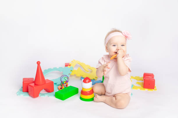 istock the kid plays with cubes on a white isolated background, space for text 1338449567
