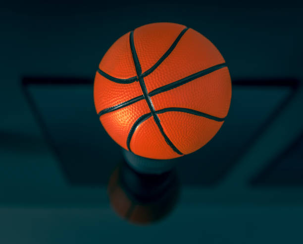 istock New, orange basketball ball on a dark surface. 1338452566