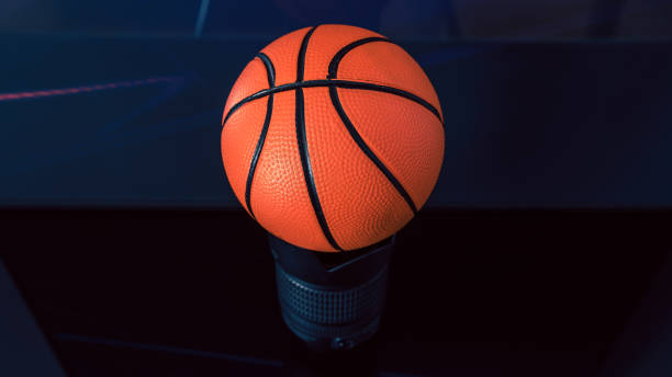istock New, orange basketball ball on a dark surface. 1338453635