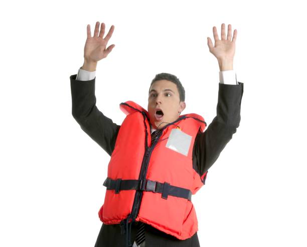 uomo d'affari che affonda nella crisi, metafora del giubbotto di salvataggio - life jacket isolated red safety foto e immagini stock