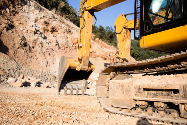 istock Hydraulic industrial machines working in quarry preparing stone for construction industry. 1338453732