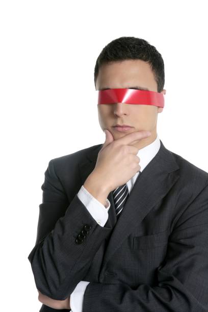 istock Red tape blindfold businessman isolated 1338454790