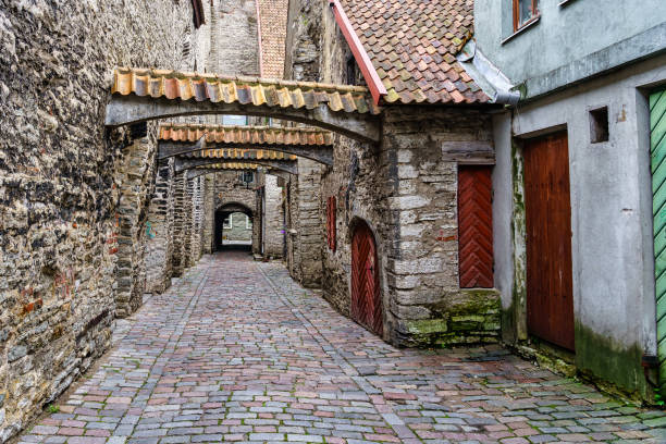 istock Charming medieval alley with tile arches in Tallinn Estonia. 1338454892