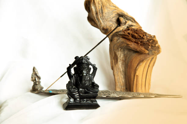 istock Lord Ganesha stone statuette on a white background 1338455342