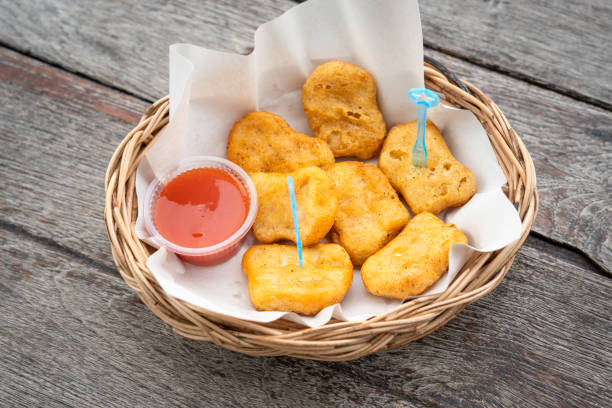 istock Deep fired chicken nugget serve on wooden table. 1338455450