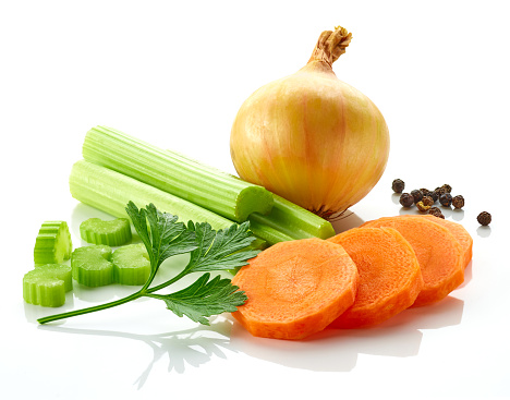 Set of spices for vegetable stock - celery sticks, carrot slices, parsley, onion and black pepper isolated on white background