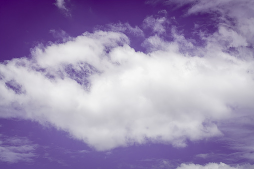White clouds and purple background