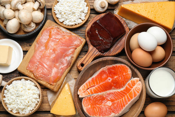 istock Fresh products rich in vitamin D on wooden table, flat lay 1338460168
