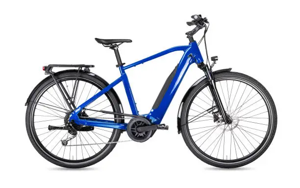 Photo of blue modern men´s mid drive motor city touring or trekking e bike pedelec with electric engine middle mount. battery powered ebike isolated white background. Innovation transportation concept.