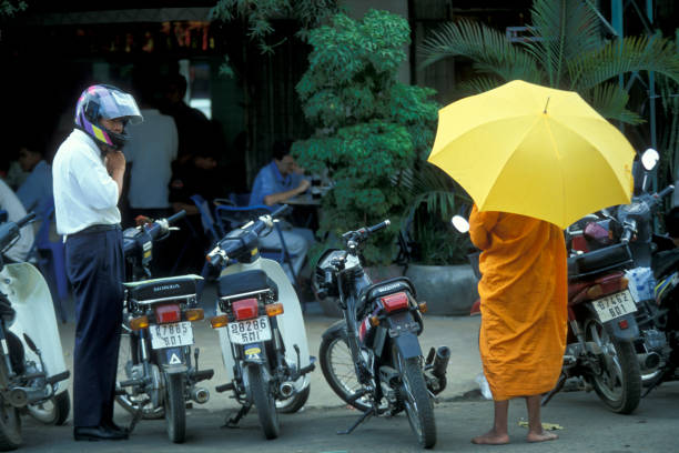 monks celebrate the tradition in the early morning in the city of Phnom Penh of Cambodia.  Cambodia, Phnom Penh, February, 2001,