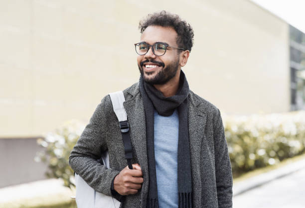 istock Handsome young man wearing warm clothing looking up 1338463378