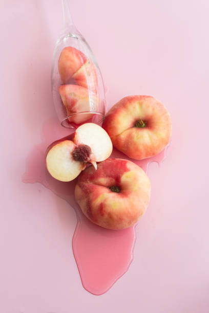istock Plum fruit with soft red orange peel put on pink background,b 1338471914