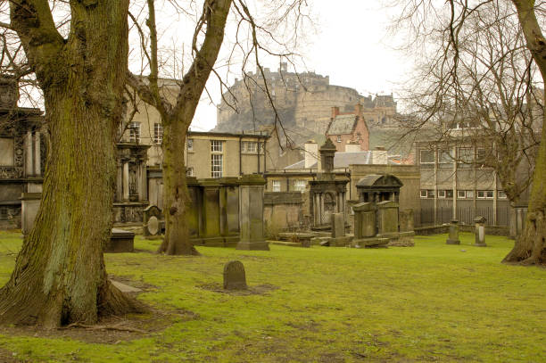 Greyfriars churchyard and Edinburgh castle in winter stock photo