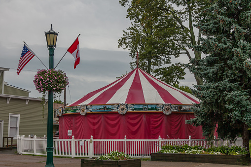 A circus tent in the park. For games or food vendors.