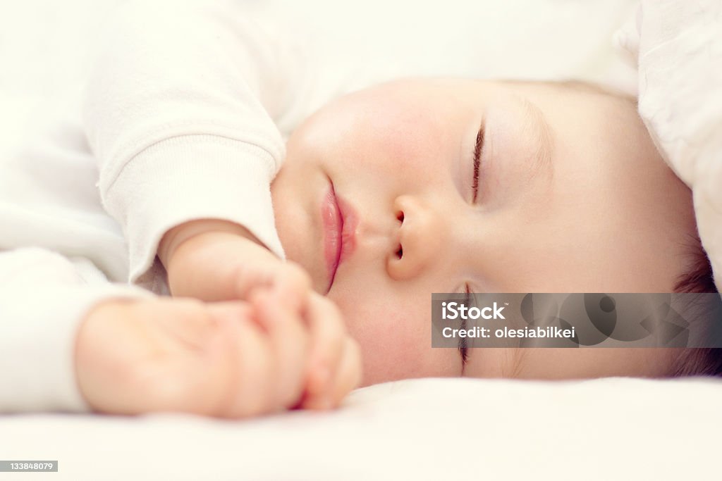 close-up portrait of a beautiful sleeping baby on white Baby - Human Age Stock Photo