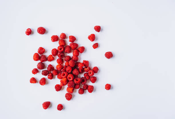 istock freshly red raspberries isolated on white background 1338485439