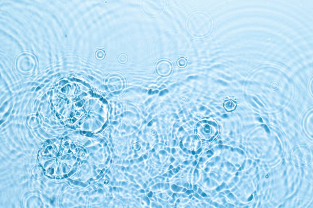 istock Blue water texture surface with ripples and transparent at sunlight. Backdrop for cosmetic or spa concept background. Copy space 1338485770