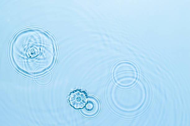 istock Blue water texture surface with ripples and transparent at sunlight. Backdrop for cosmetic or spa concept background. Copy space 1338488678