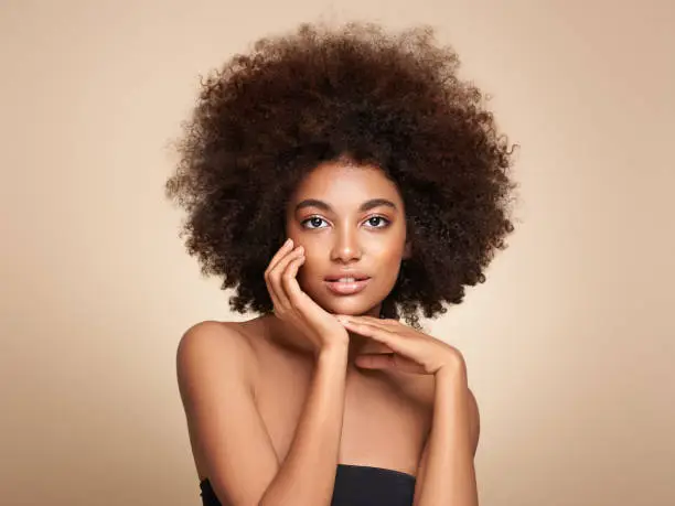 Photo of Beauty portrait of African American girl with afro hair