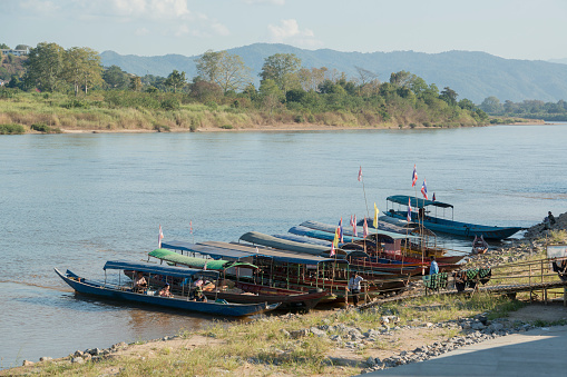 the Boat pier at the Village of Huay Xay in Lao at the Mekong River from the view in the northwest Lao in Lao.   Lao, Huay Xay, November, 2019