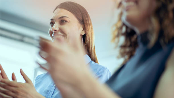 istock Businesspeople applauding an achievement 1338505406