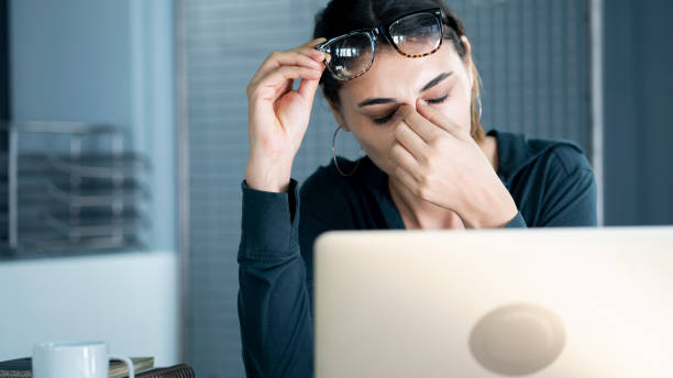 Tired young woman feel pain eyestrain stock photo