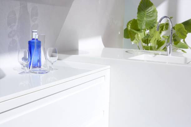 istock White modern kitchen, blue water bottle and plants 1338507087