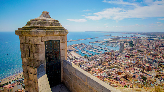 View of Alicante from the Garita de la Campana in the Castle of Santa Bárbara, views of the port, the beach and the city center