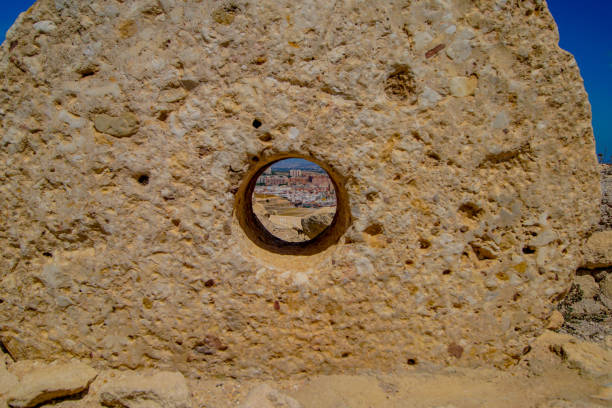 Embrasure for cannon on medieval fortress brick wall. Detail of the military fort  called “The Old Town“ near the Croatian town of Sisak. It was built in 1541, and today there is a museum.