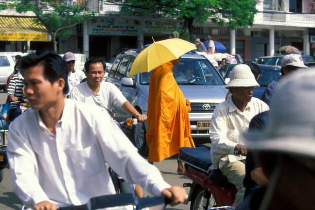 monks celebrate the tradition in the early morning in the city of Phnom Penh of Cambodia.  Cambodia, Phnom Penh, February, 2001,