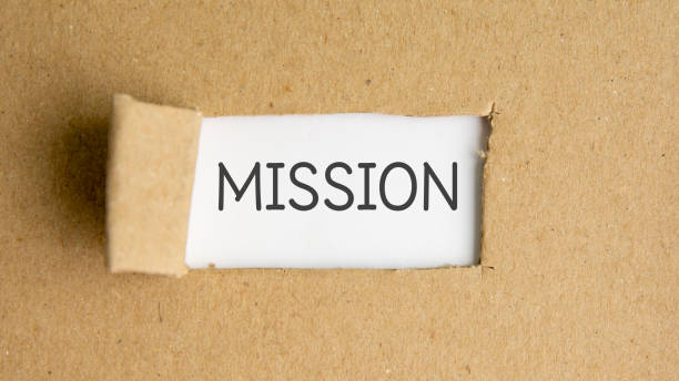 istock the text mission behind torn brown paper 1338511843
