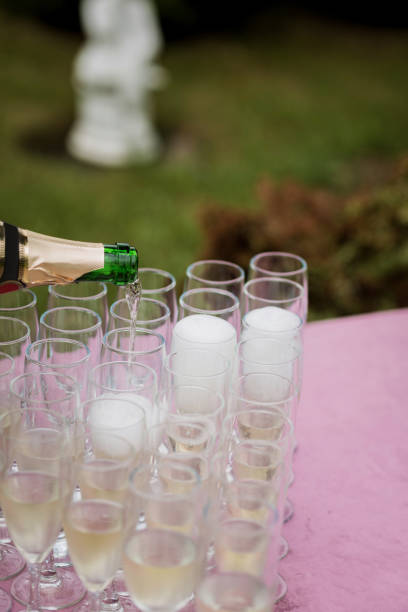 istock the waiter pours champagne 1338516174