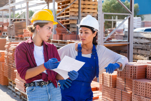 istock Two  female storekeepers are discussing an estimate at the warehouse 1338517643