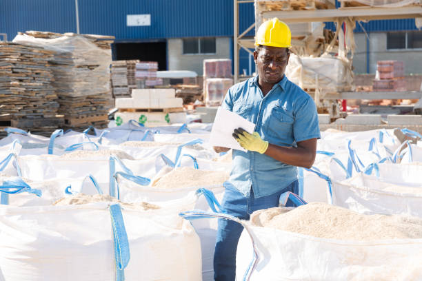 istock African american worker keeps records of bulk construction materials in warehouse 1338517654