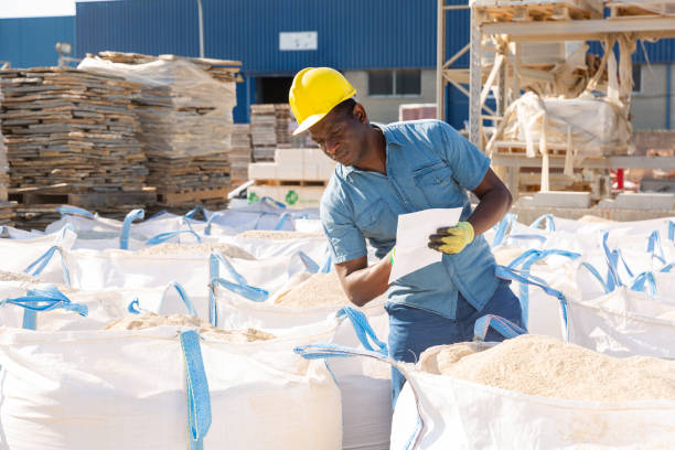 istock Worker checking quality of building mix at hardware store 1338517659