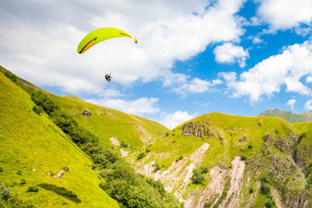 istock Scenic view at Gudauri View Point monument with paragliding parachutes 1338518749