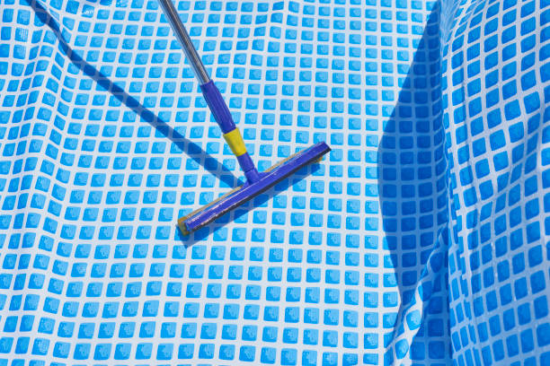 cleaning home inflatable swimming pool - above ground pool imagens e fotografias de stock