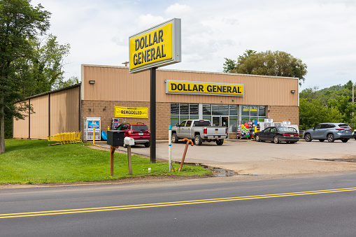 Smethport, PA, USA-15 August 2021: Dollar General store in downtown.  Building and signs.