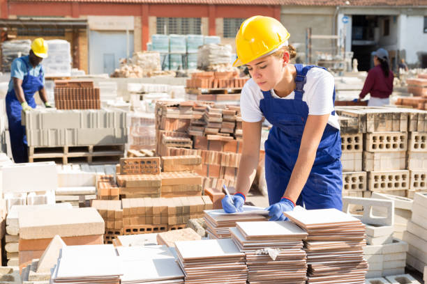 istock Girl worker keeps records of ceramic tiles 1338525141