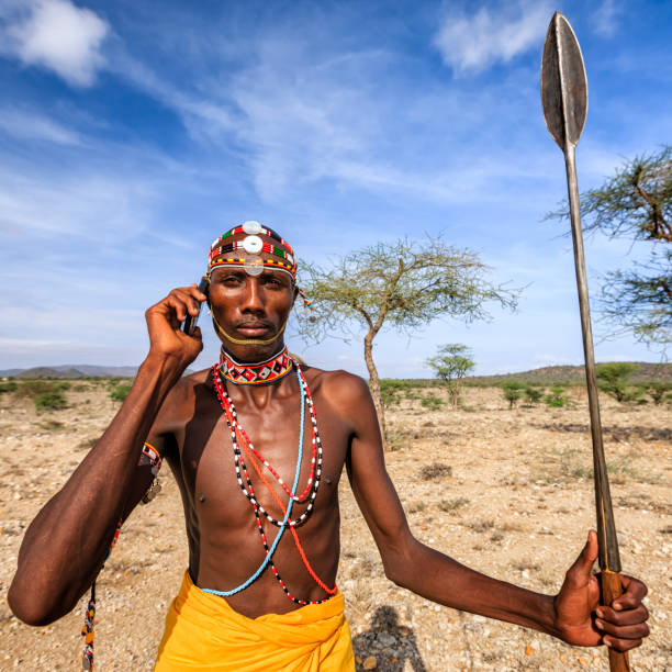 istock Samburu tribe warrior using mobile phone, central Kenya, East Africa 1338526921