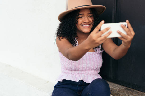 istock teenager checking her phone 1338527727