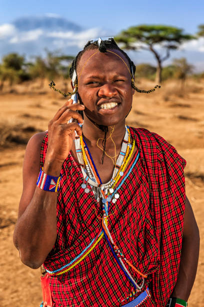 istock Warrior from Maasai tribe using mobile phone, Kenya, Africa 1338527763