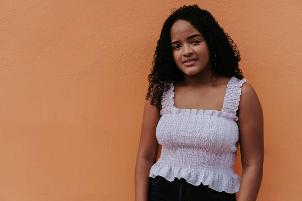 istock teenager Over A Orange Background 1338527764